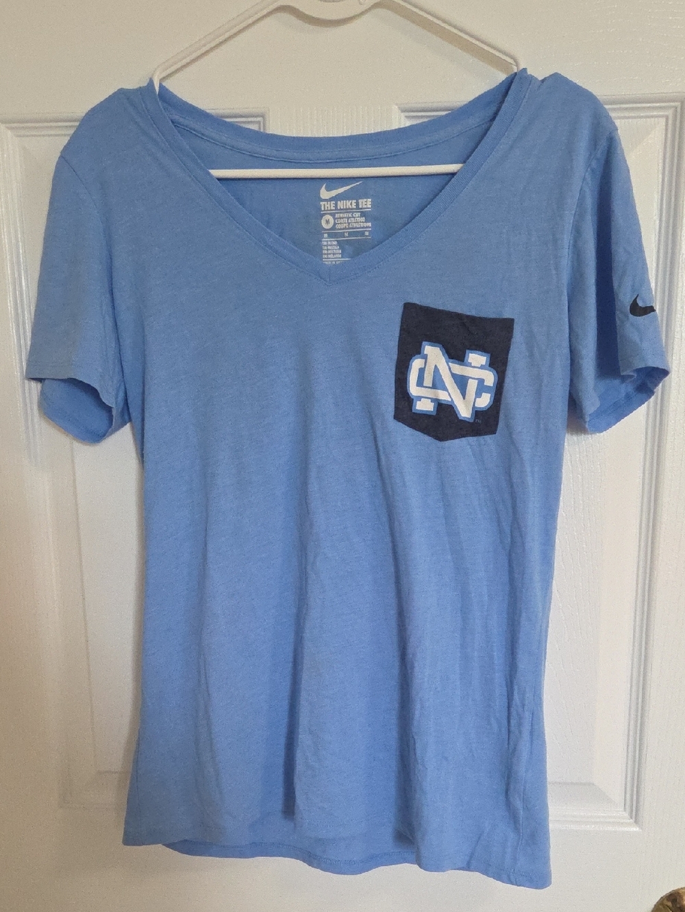 UNC Light Blue V‑Neck Tee with Navy Pocket Logo